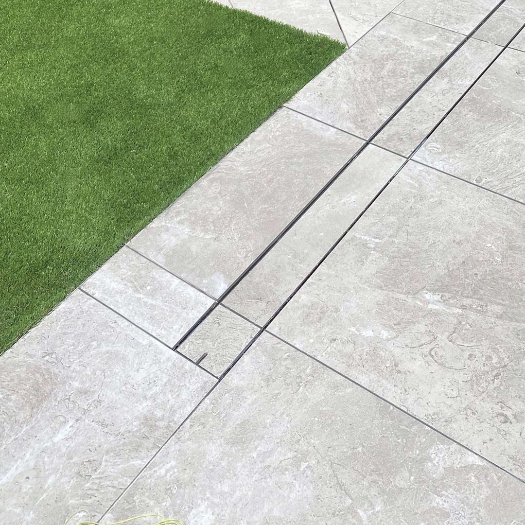 https://evolutionwls.com.au/wp-content/uploads/2023/09/HIDE-Linear-Drain-Cover-Kit-Tile-Inlay-5-Installed.jpg